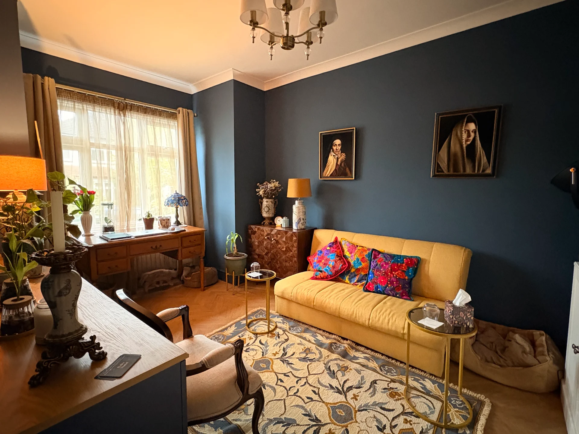 Pedro Daniel Therapy Practice Room Therapy practice room with a yellow sofa, armchair and dark blue walls