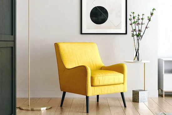 d3296c9ffa78d365282de601a9ea9135 A yellow armchair in a contemporary room with a modern art piece hanging above it and a chrome floor lamp next to it.